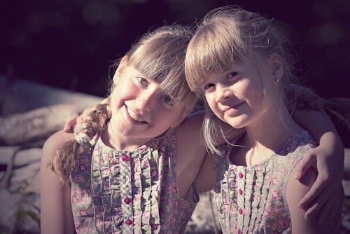 2 Girl on Grey and Pink Dress on Daytime