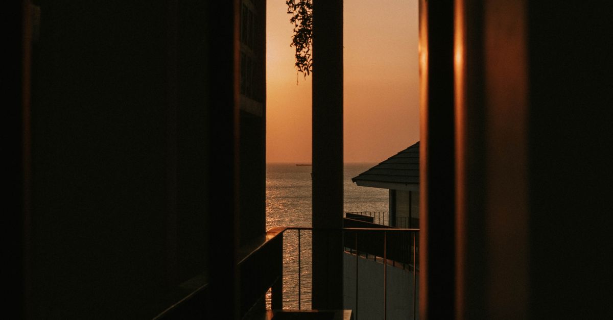Captivating sunset view seen through a seaside house in Vũng Tàu, Vietnam.