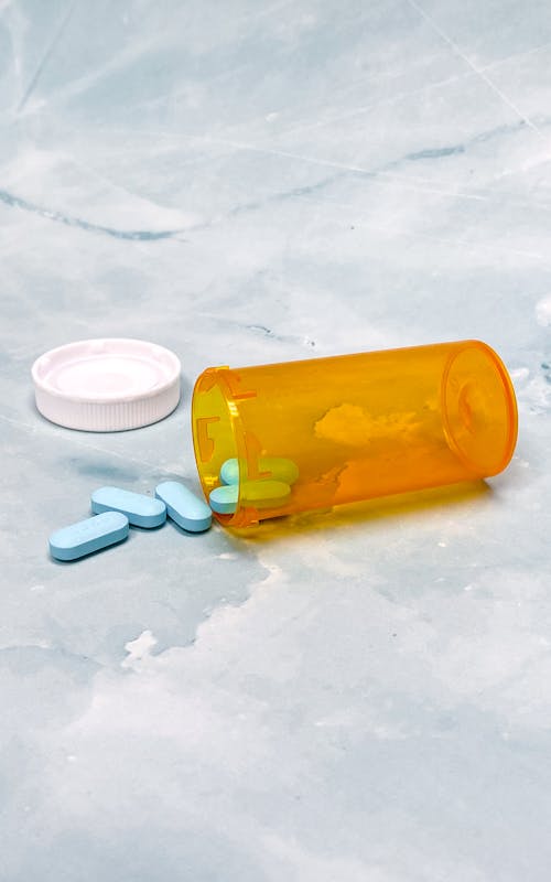 Pills in Medical Disposable Bottle