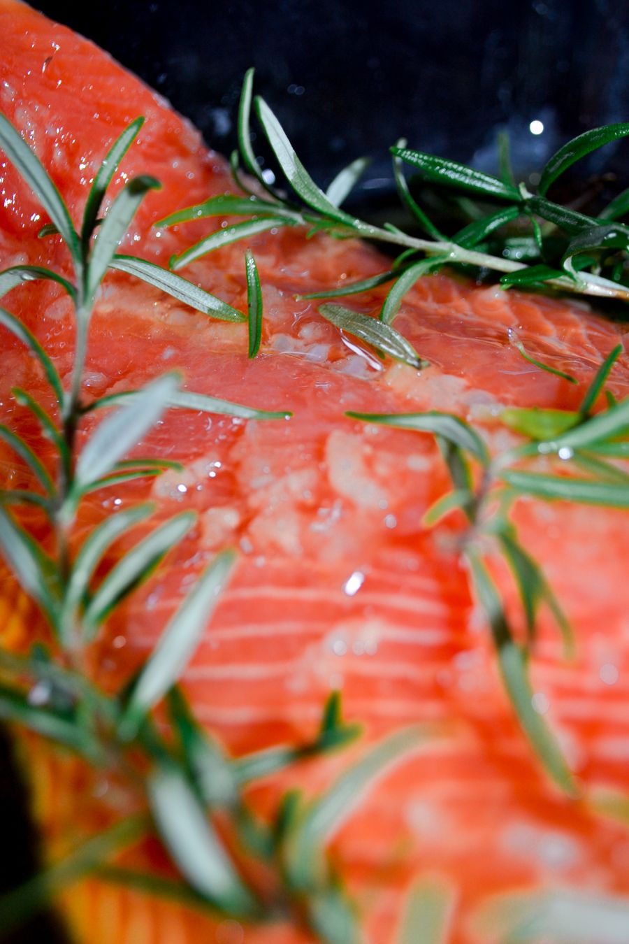 Baked sockeye salmon recipe — raw sockeye fillet seasoned with rosemary before oven baking