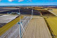 Windmills And Green Grass Field
