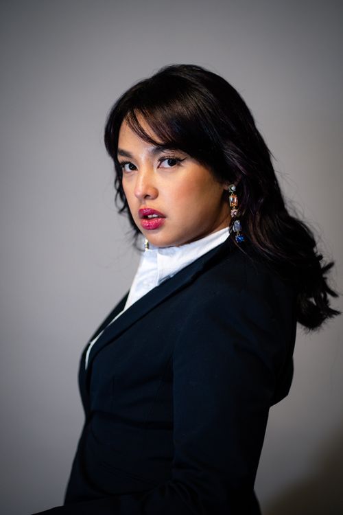 Free Elegant woman in formal attire with professional lighting and background. Stock Photo