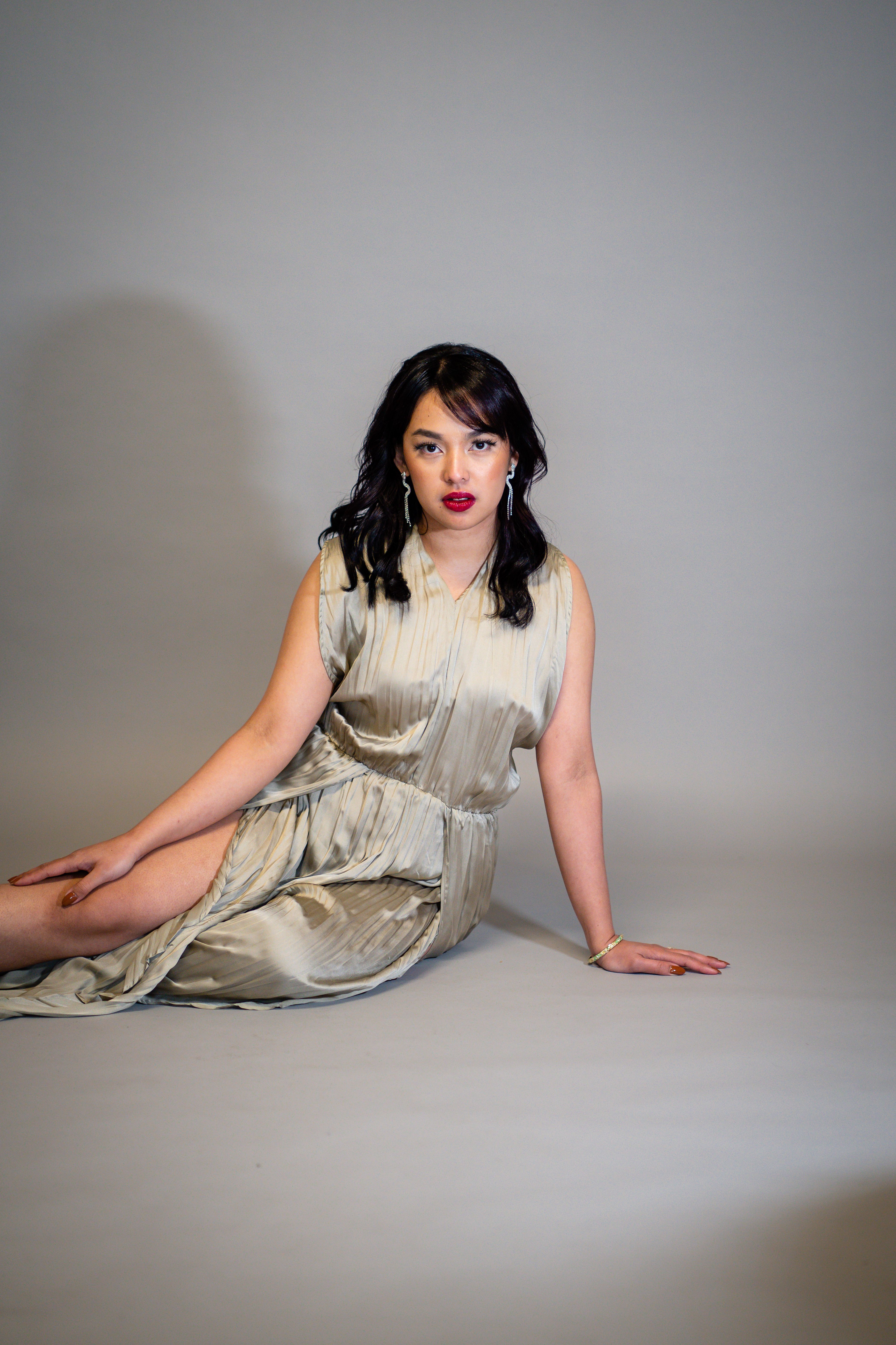 A Woman in a Dress Sitting on the Floor · Free Stock Photo