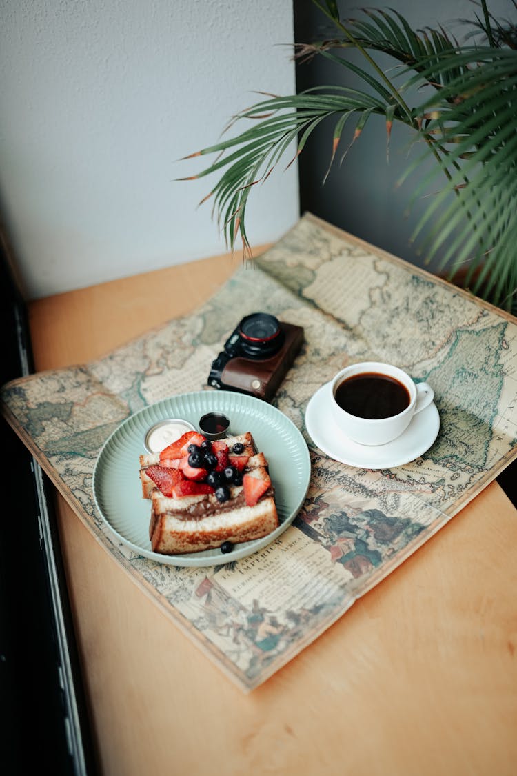 Cake, Camera And Coffee On Map