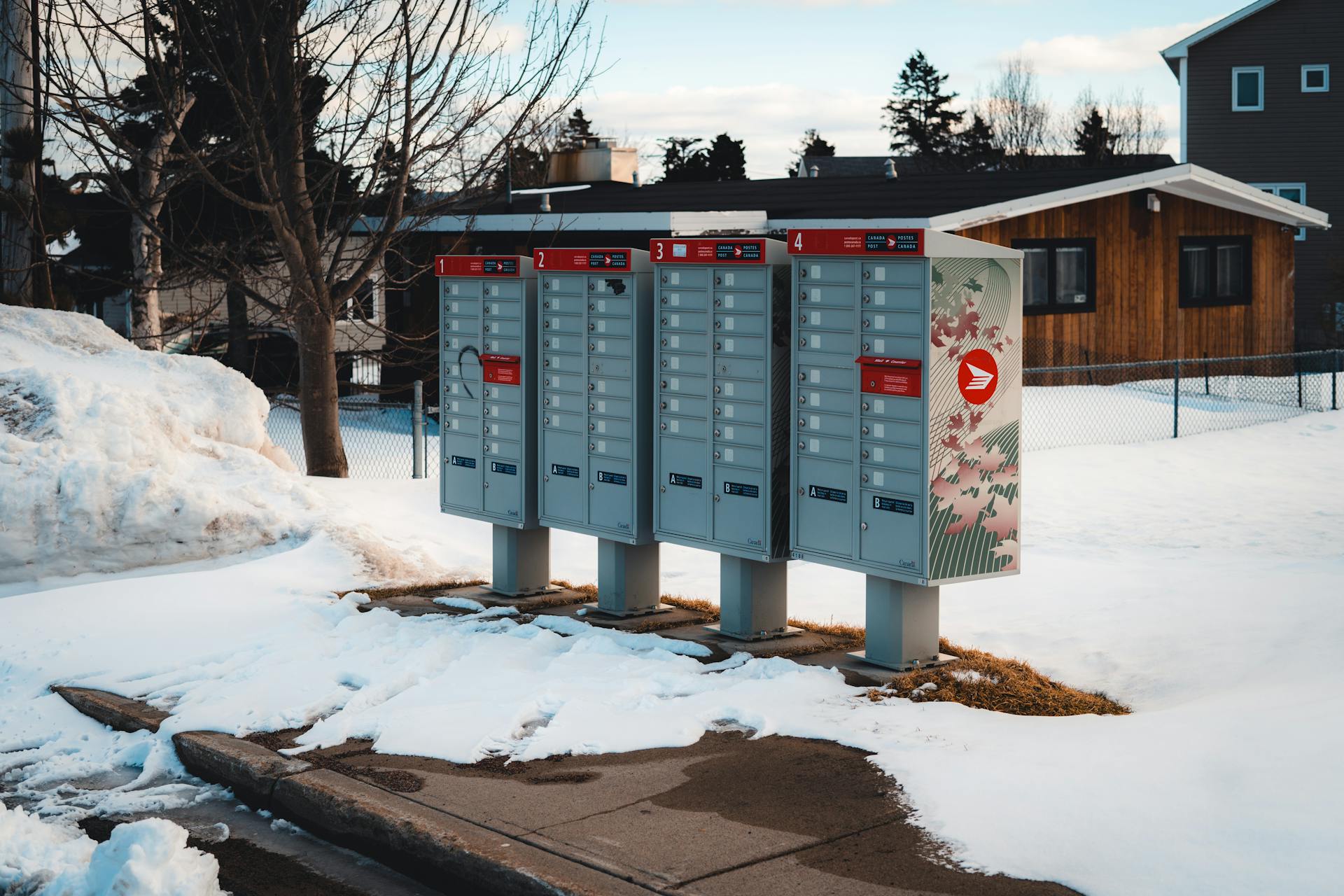 Mailboxes on Sidewalk in Snow