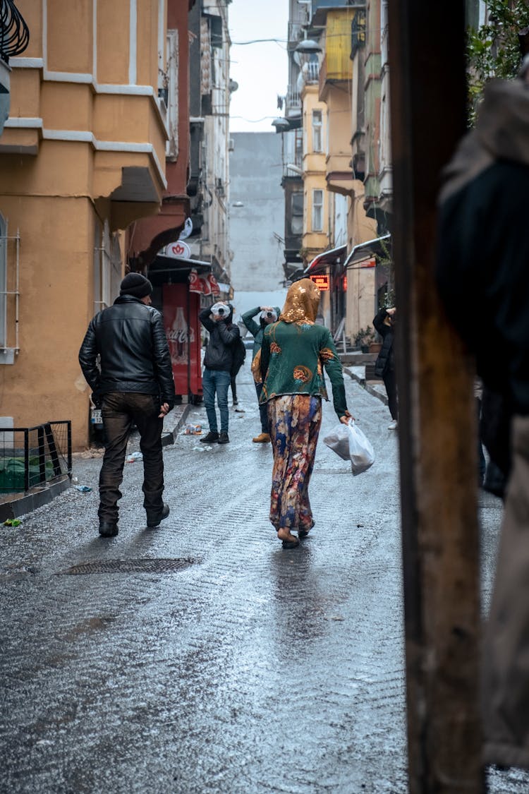 People Walking In A City 