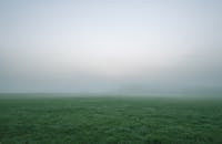 Selective Photography of Green Grass Field Under White and Gray Sky