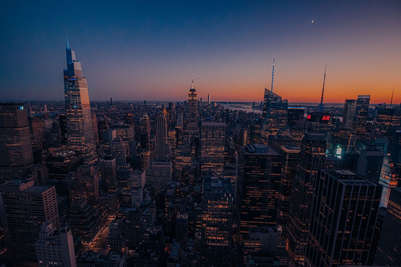 breathtaking view of new york s skyline with skyscrapers at sunset cap