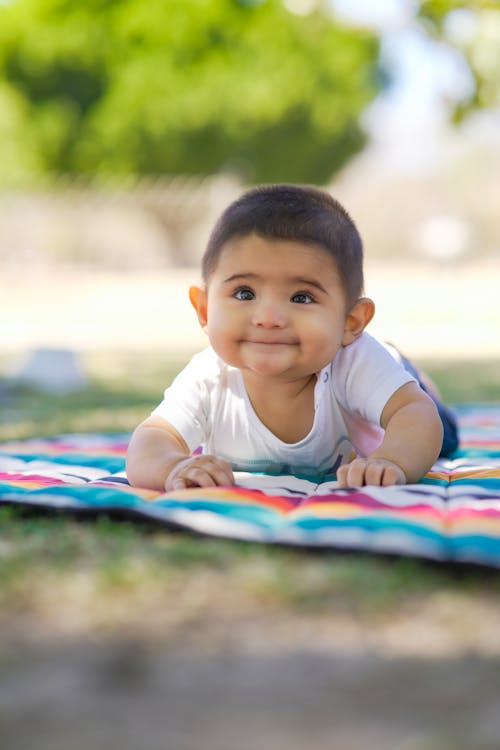 A nice little girl in shorts and a vest. Stock Photo by