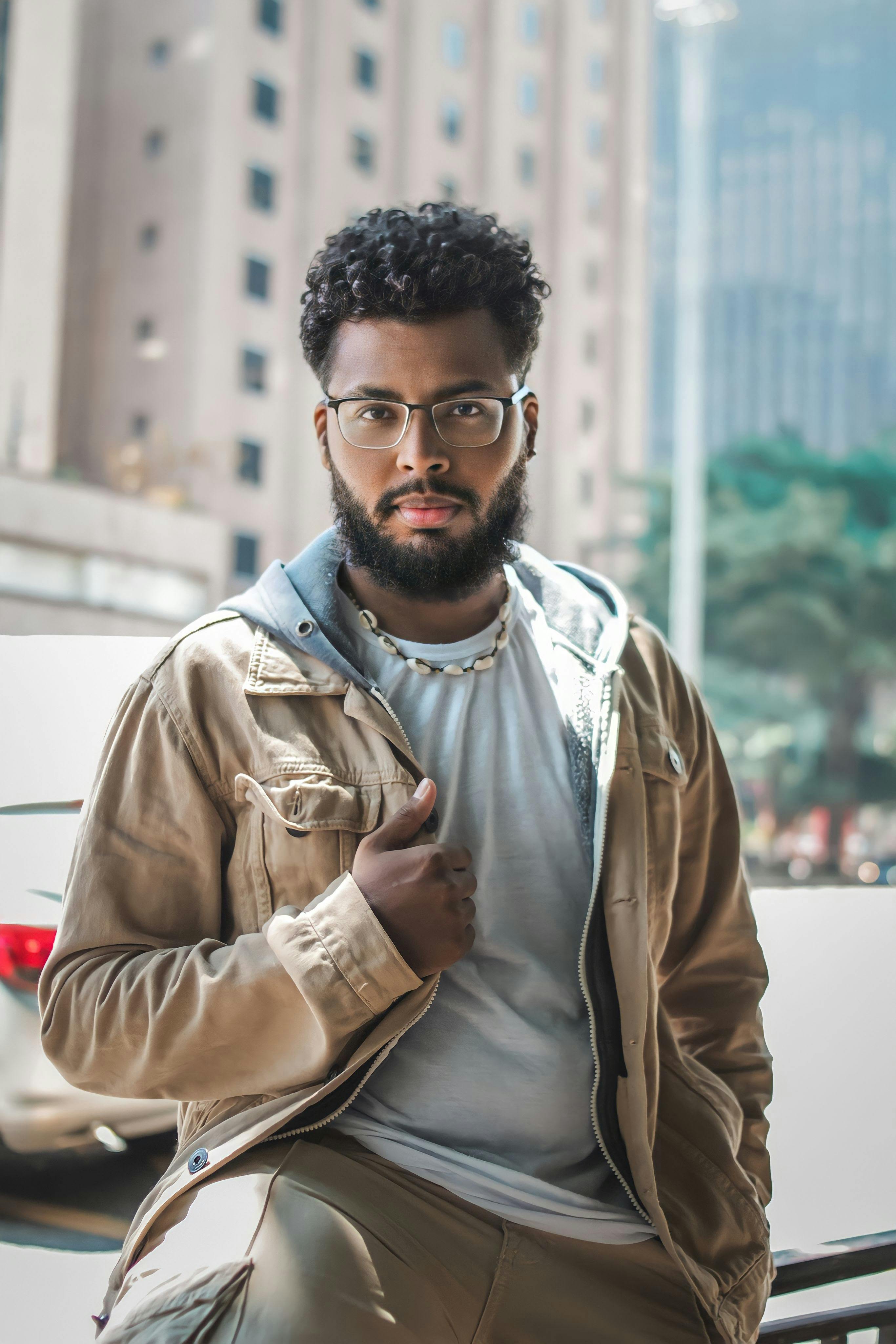 Man standing and posing in jacket free stock photo