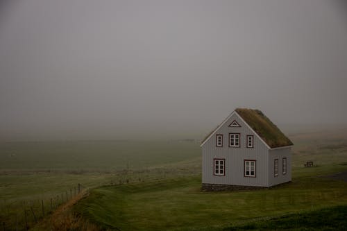 Farmhouse on Field on Foggy Day