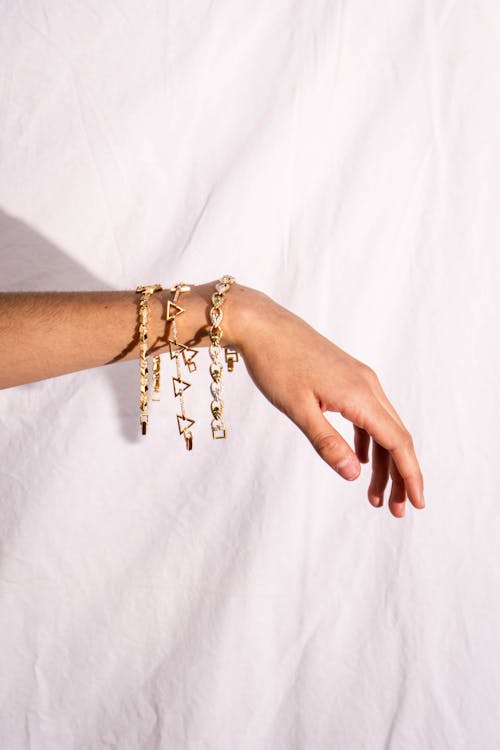 Close-up of an Arm of a Person Wearing Bracelets