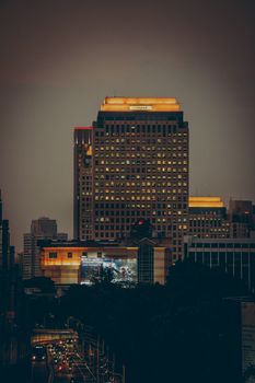 A stunning view of Jakarta's skyline with illuminated skyscrapers during the evening.