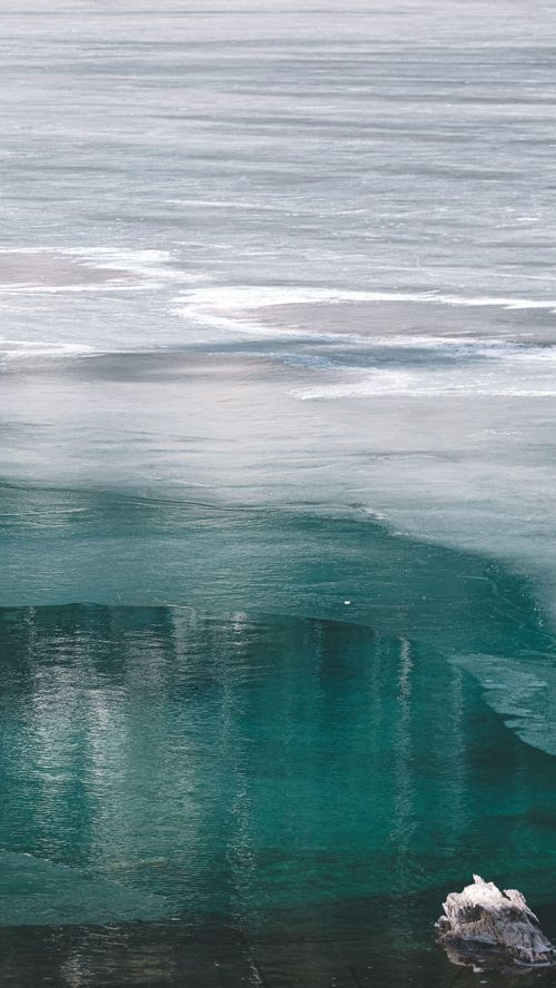 Free A tranquil view of icy ocean water during the winter season. Stock Photo