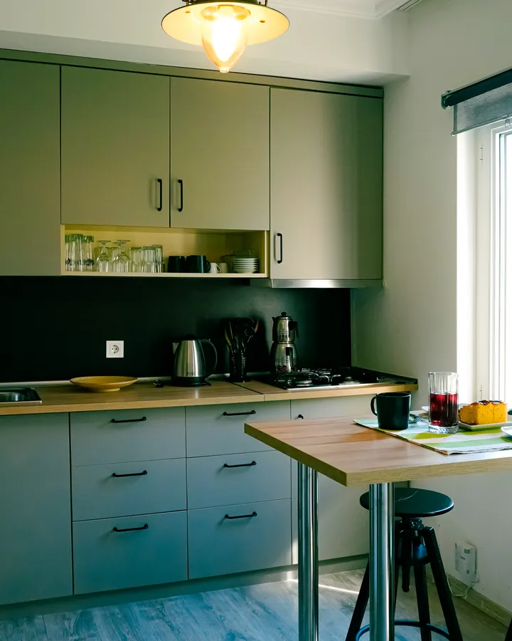 About our refrigerator repair team Interior of a modern kitchen with refrigerator and cabinets