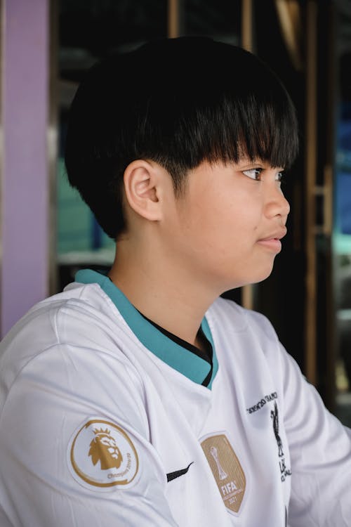 Gratis Fotos de stock gratuitas de camiseta de fútbol, chico asiático, joven Foto de stock