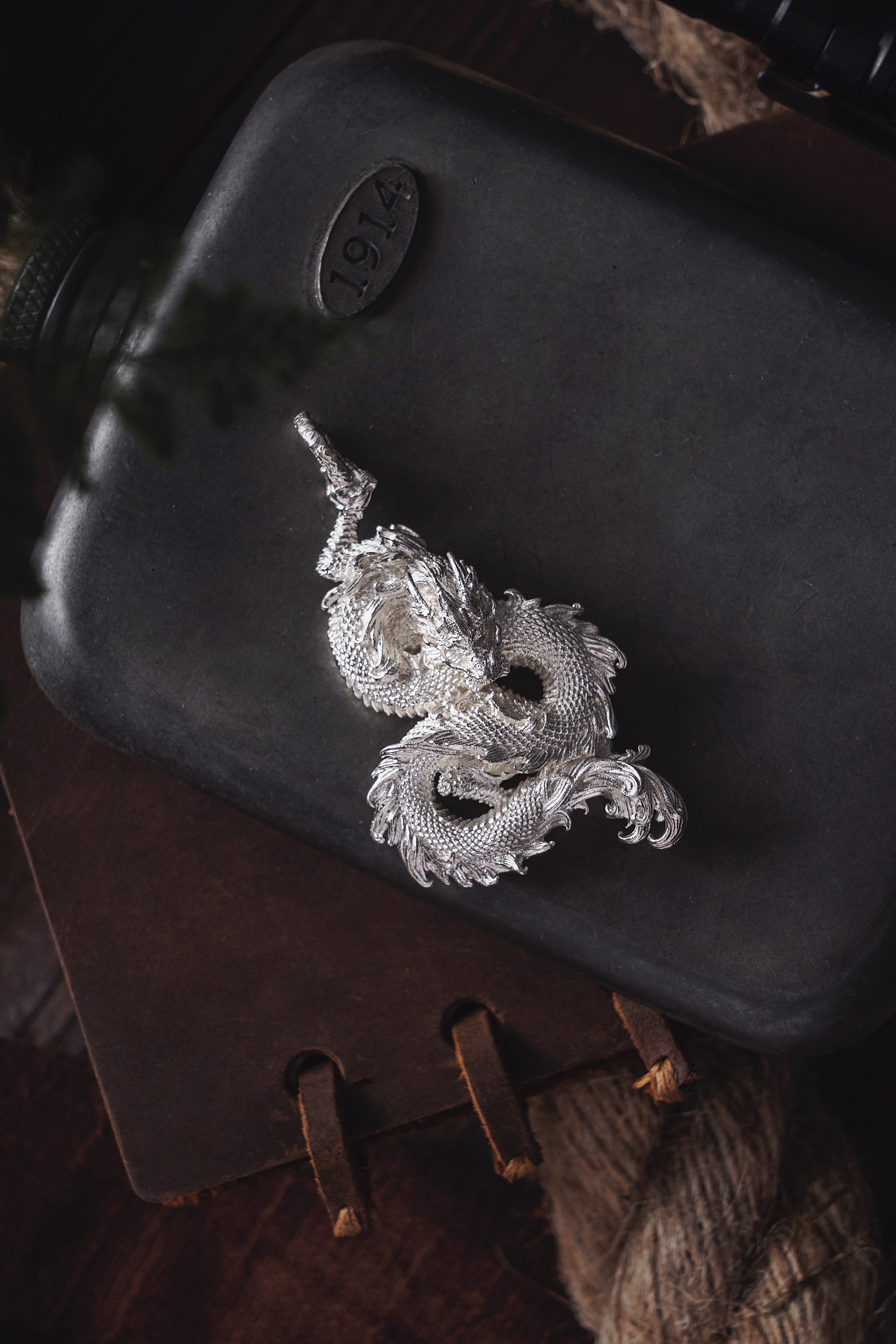 Vintage Dragon Key Chain and a Canteen · Free Stock Photo