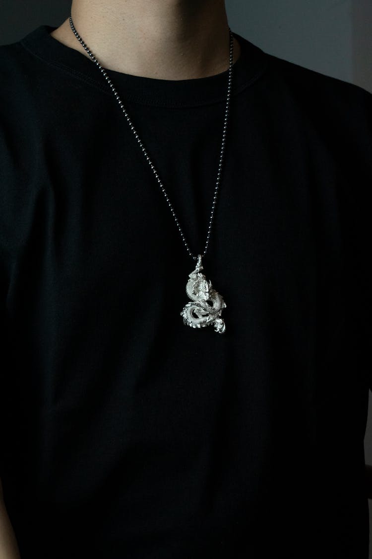 Man Wearing A Vintage Dragon Pendant 