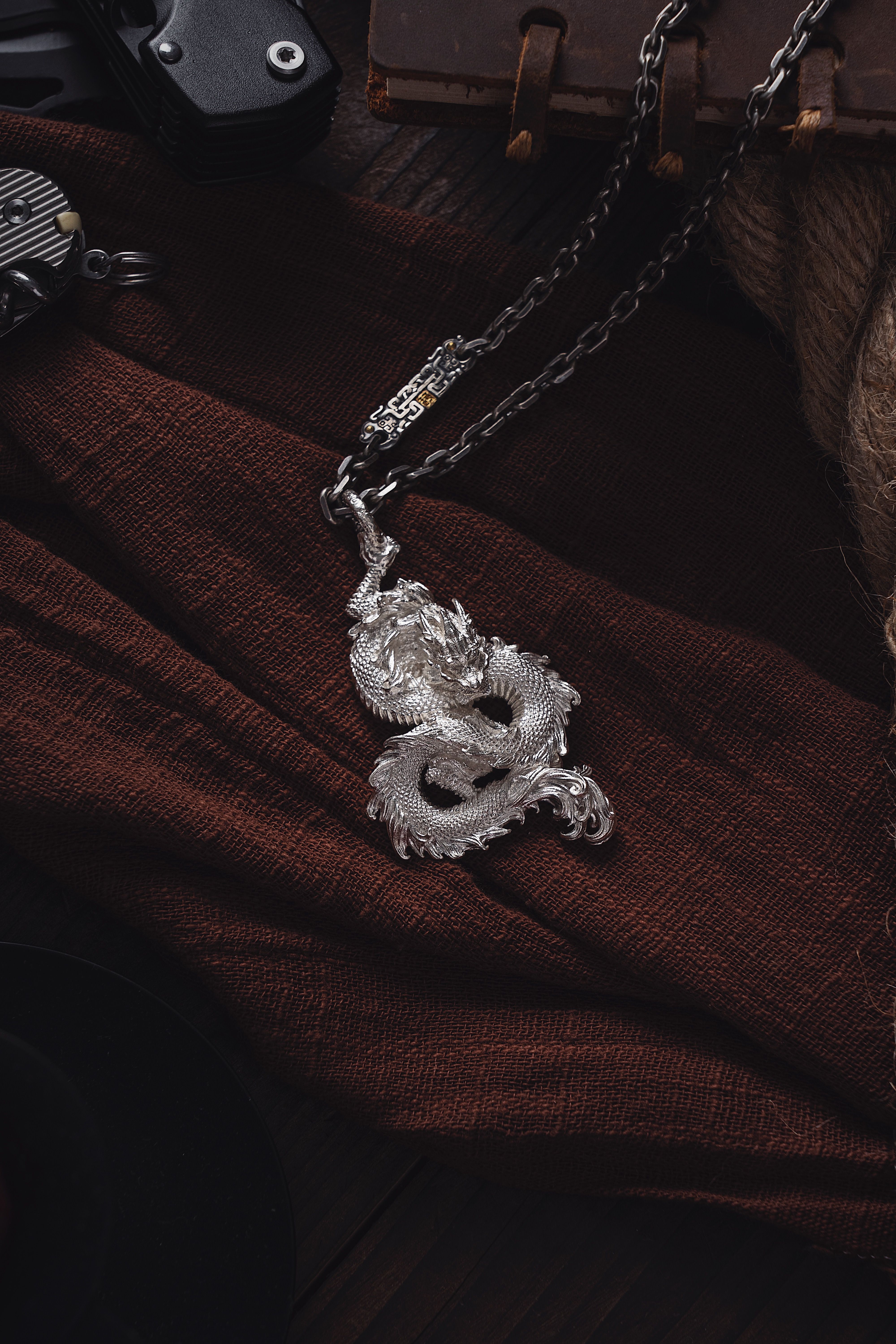 Silver Dragon on a Chain · Free Stock Photo