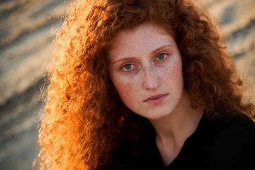 Portrait of a Redhead with Curly Hair and Freckles 