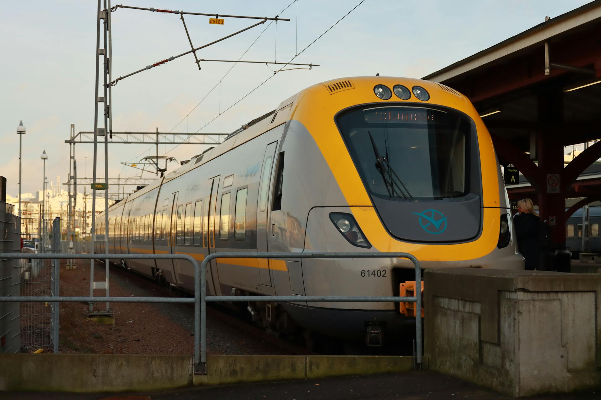 A sleek train at Gothenburg station in Sweden during daylight.
