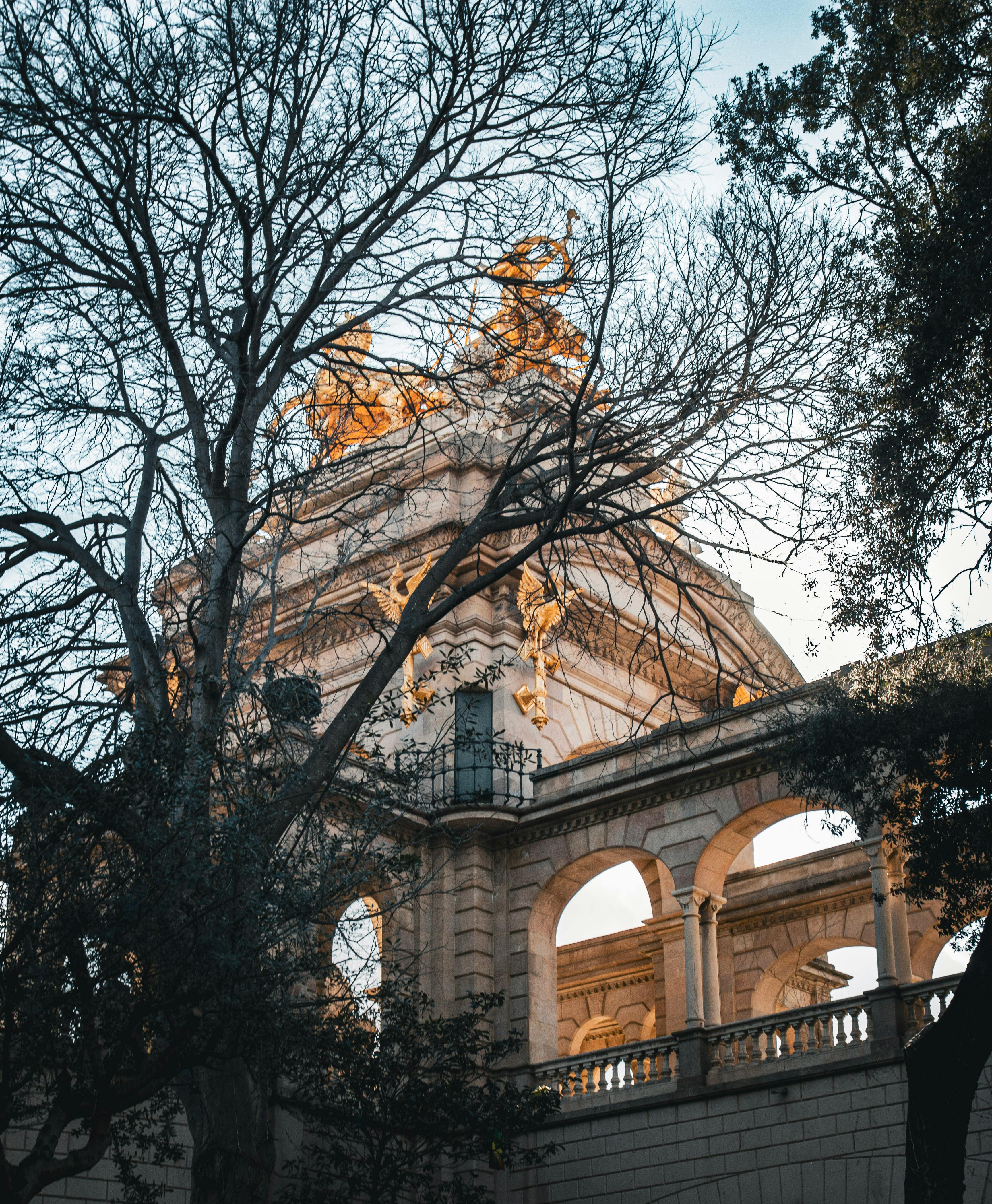 a building with a clock on top and trees in the background