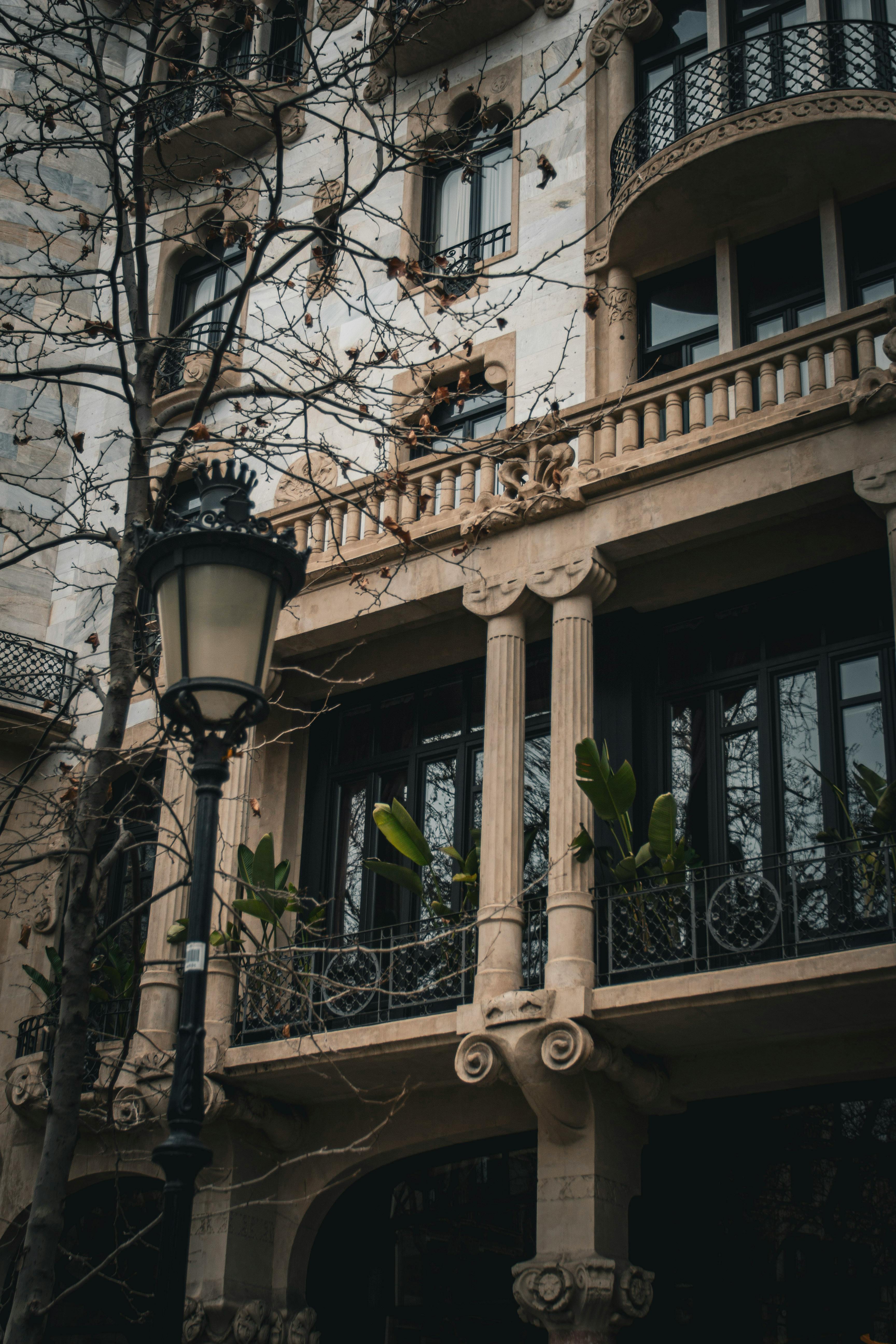 a street lamp and a building with balconies