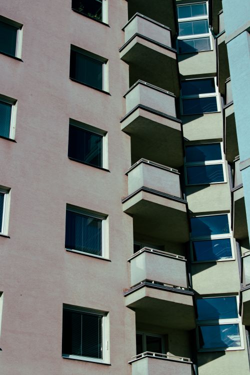Free Detailed view of a contemporary urban residential building facade with balconies Stock Photo
