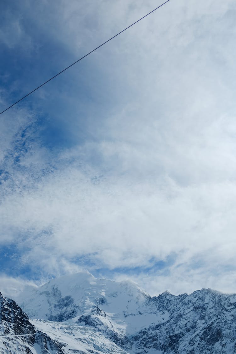 Line Under Clouds In Mountains