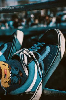 Close-up of trendy sneakers with fun patterned socks, perfect for fashion enthusiasts.