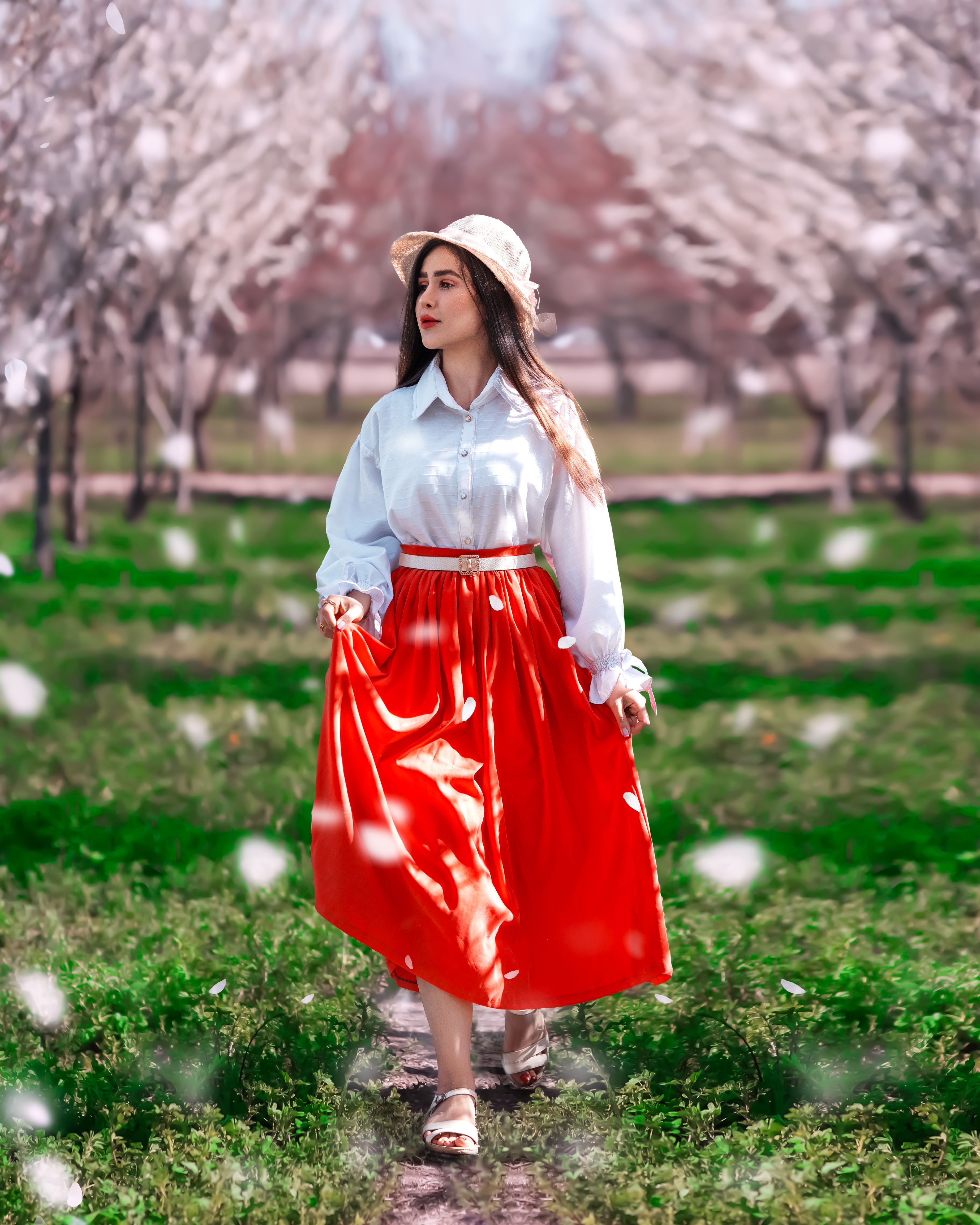 Young Woman in a White Shirt and Red Skirt Posing in a Park · Free ...