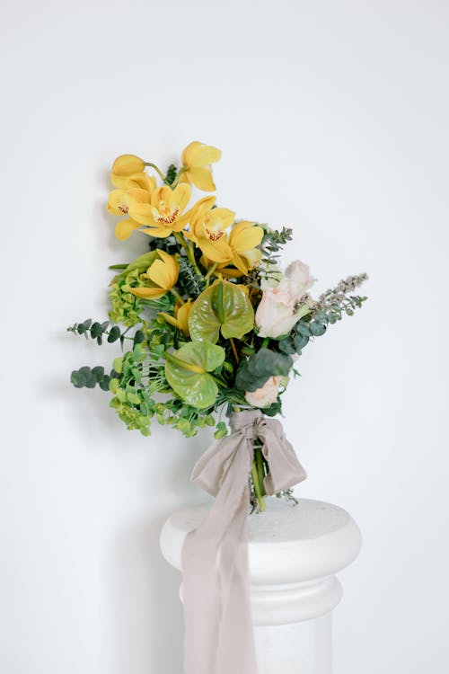 A Bouquet with Yellow Orchids and White Roses 