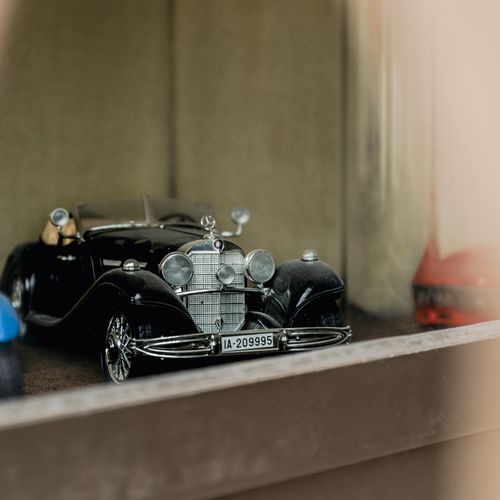 Free Close-up of a vintage black toy car showcasing intricate details in Stuttgart, Germany. Stock Photo