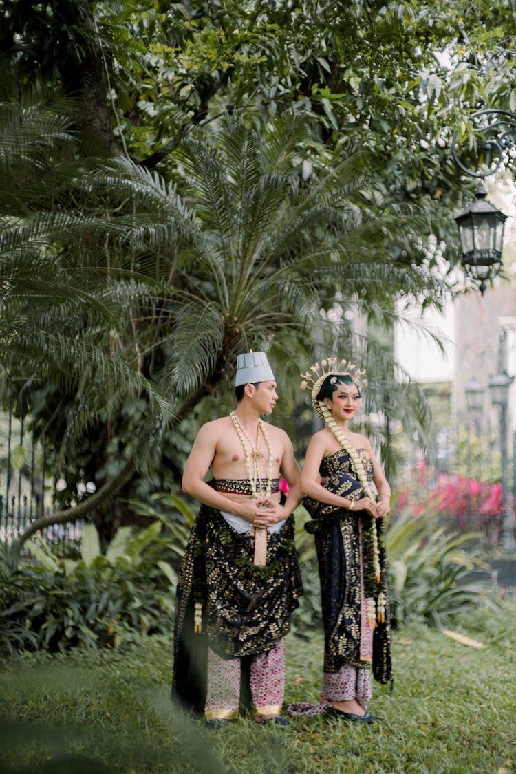 Couple Standing In A Park 