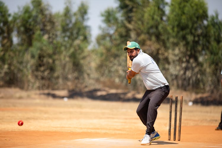 Man Playing Cricket