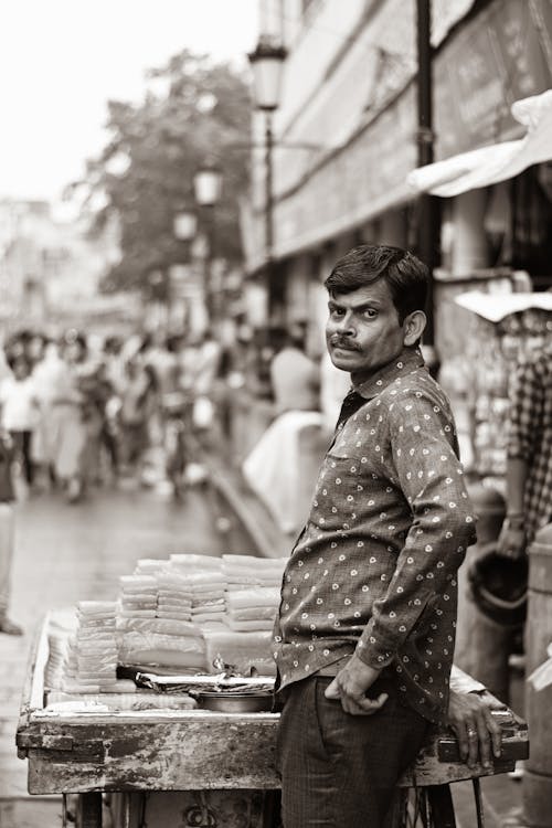 Black and White Picture of a Man on the Street Market 