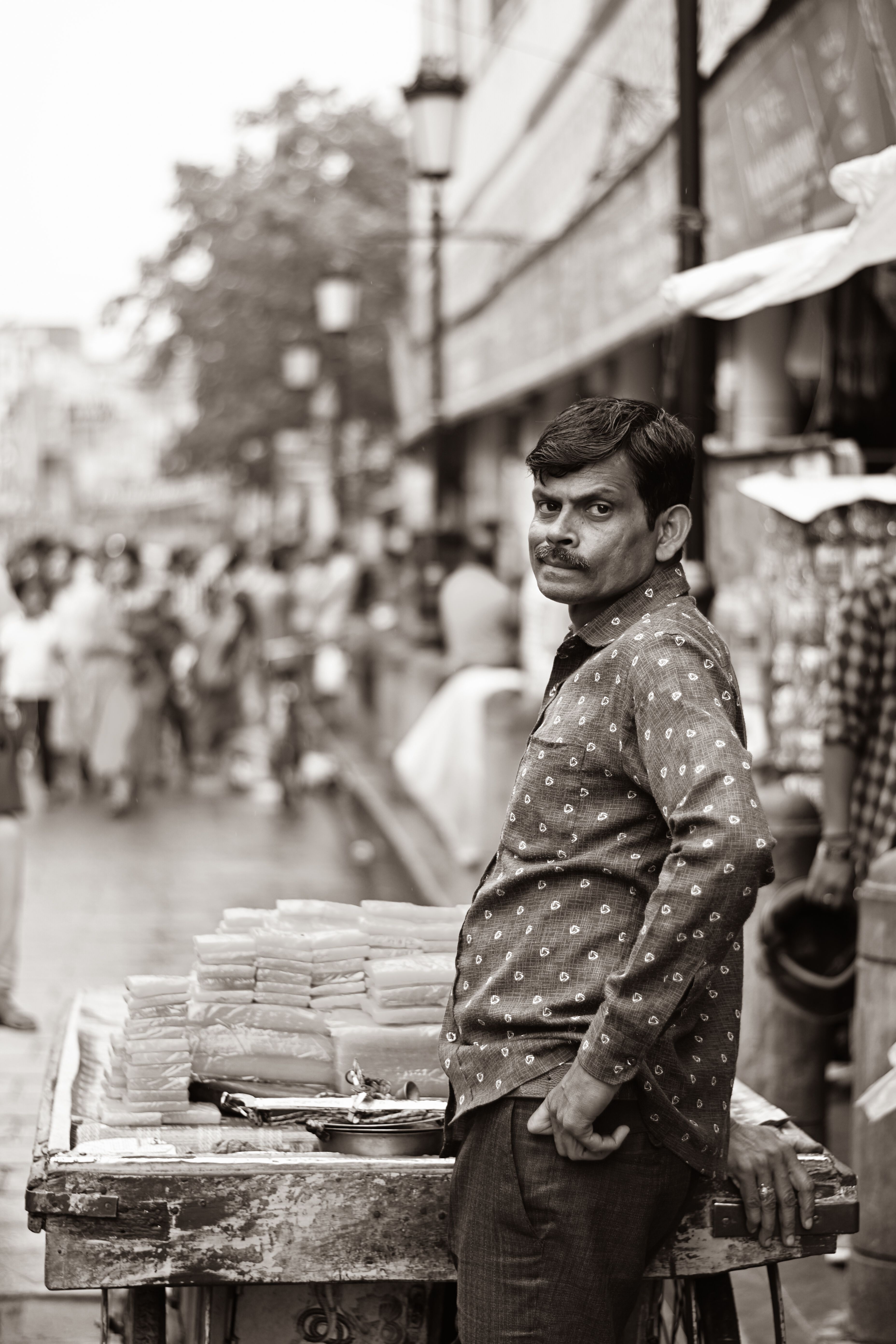 Black and White Picture of a Man on the Street Market · Free Stock Photo