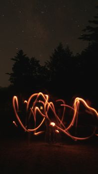 Enchanting forest scene with long exposure light trails and starry night sky.. pexels, enchanting, forest