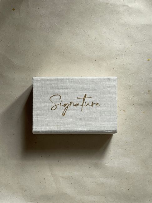 Minimalist small canvas featuring 'signature' text on neutral background.