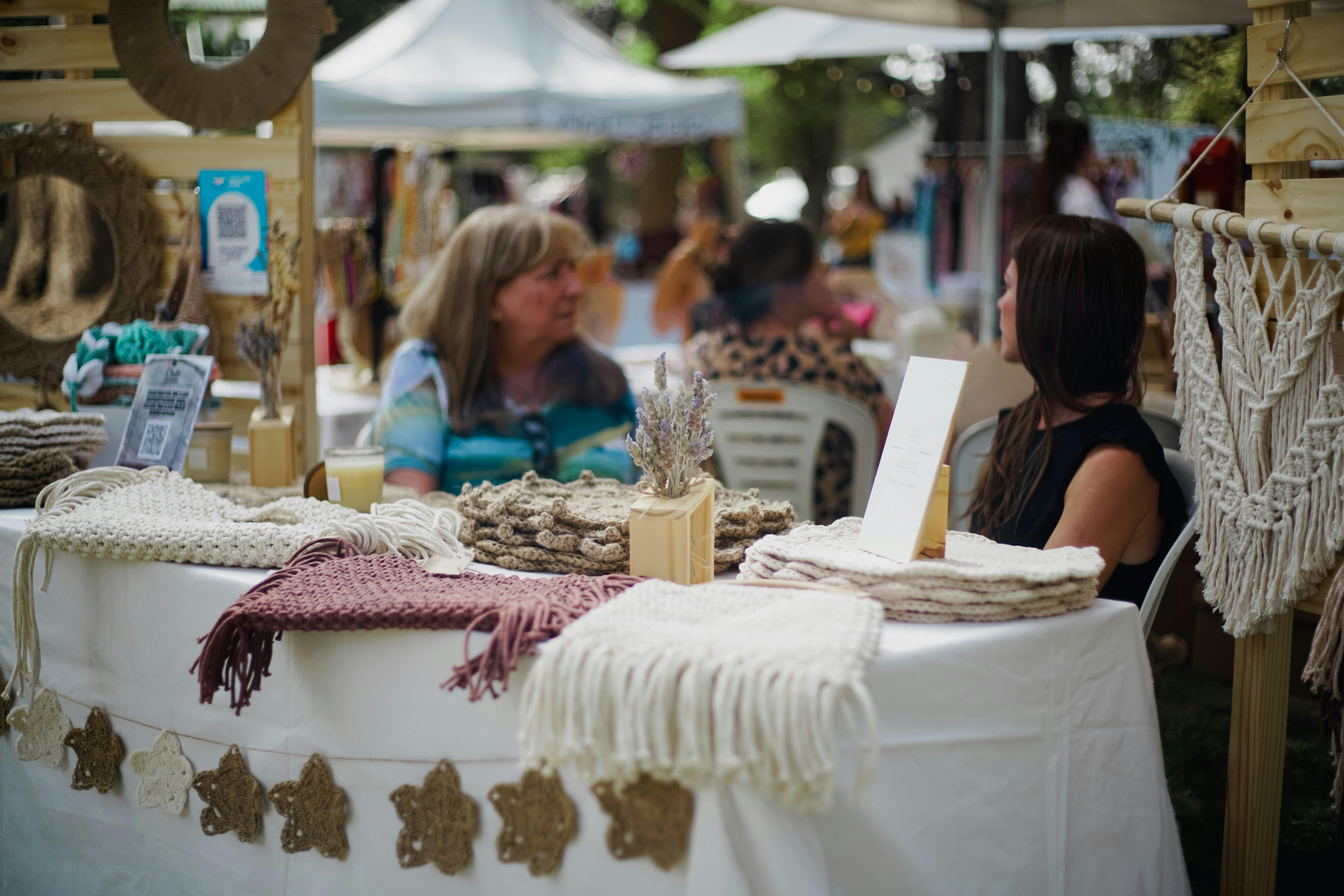 Crocheted yarn swatches displayed on a wooden table, symbolizing creativity.