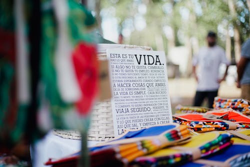 Merchandise and Sign at Market Stall