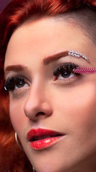 Glamorous portrait of a woman with vibrant makeup and accessories in studio setting.