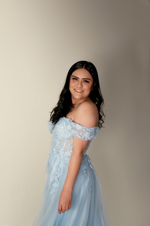 Smiling Woman in Blue Dress