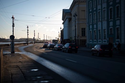 Street scene with cars and historic architecture in Saint Petersburg, Russia.