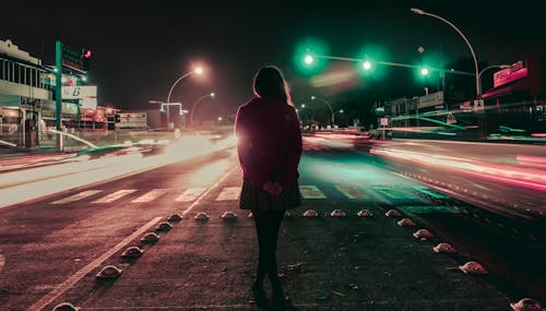 Free Woman Standing In The Middle Of The Road Stock Photo