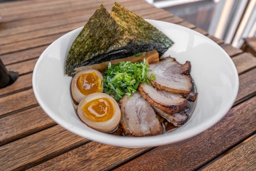 A savory bowl of Japanese ramen with toppings, perfect for a hearty meal.