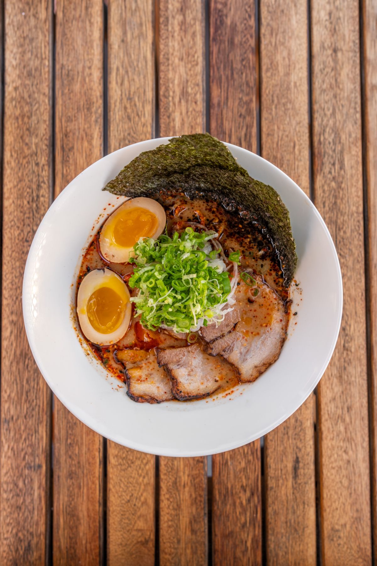 Authentic Japanese ramen with chashu pork, marinated egg, nori, and scallions