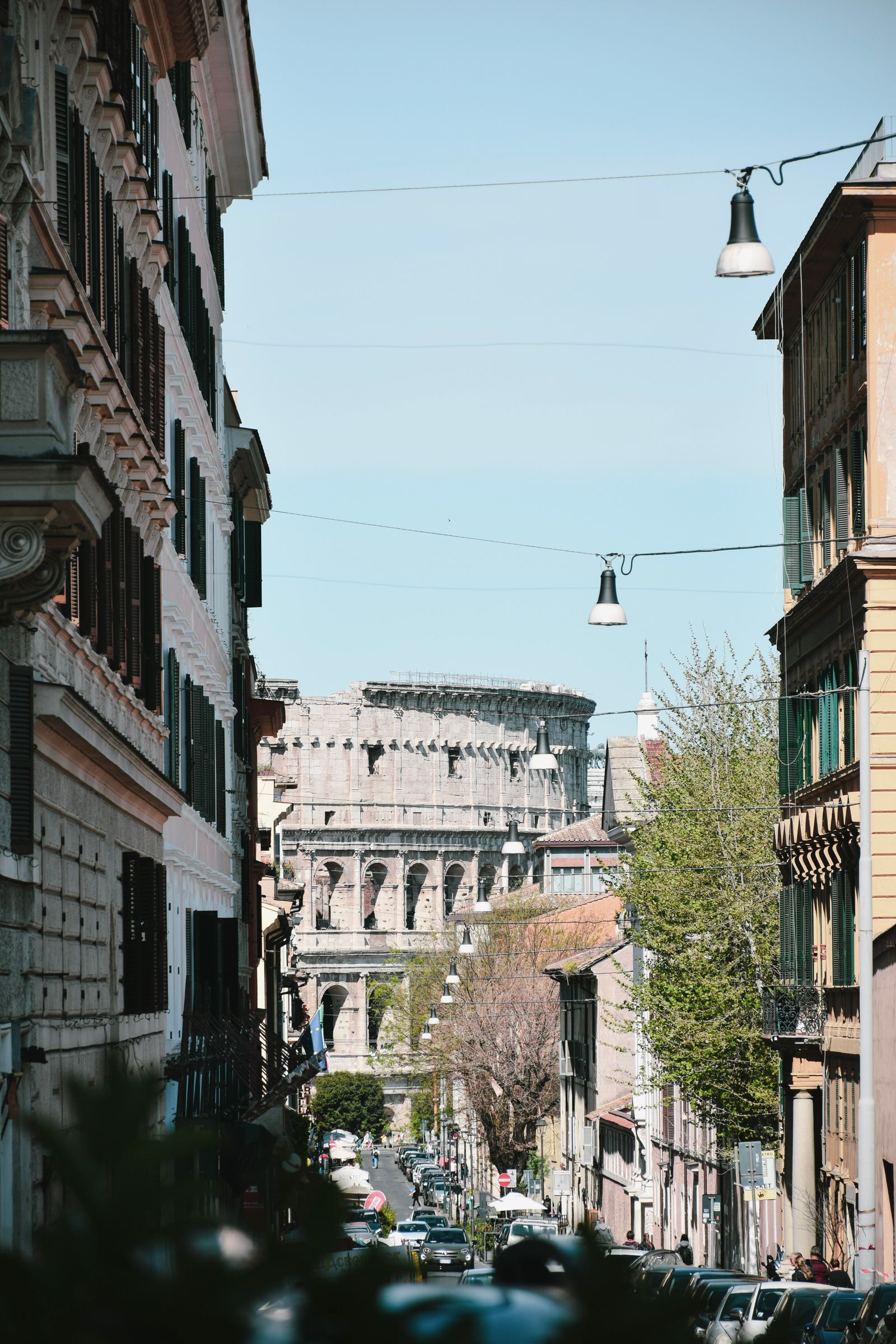 Rome Colosseum street view with Roman ruins in foreground