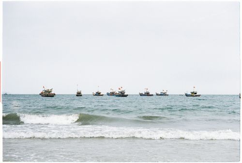 Free Serene view of fishing boats on the sea from Da Nang, Vietnam coastline. Stock Photo