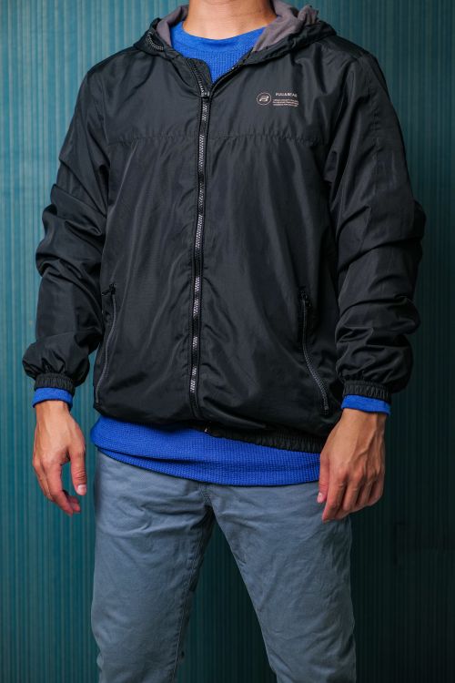 Free Portrait of a man in casual clothing posing against a blue background. Stock Photo
